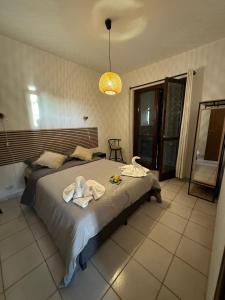 Postel nebo postele na pokoji v ubytování Villa Lidia