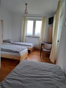 Cama o camas de una habitación en P&P noclegi - Krosno Sikorskiego