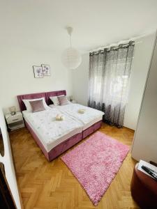 Säng eller sängar i ett rum på Apartman Bago Deluxe