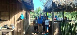 a group of people standing outside of a building at Lodging and adventures in Soposo