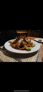 a plate of food sitting on a table at Surangi in Kosgoda