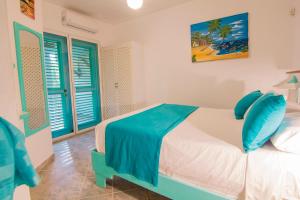 Una cama o camas en una habitación de Hotel Playa Colibri