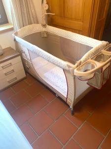 a bunk bed in a room with a tiled floor at Ferienhaus Almenland in Arzberg