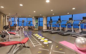 a gym with treadmills and elliptical machines at Ascott Raffles City Chengdu in Chengdu