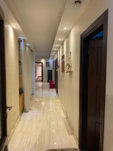 a corridor of a hospital hallway with at sfenx abartment hotel in Cairo