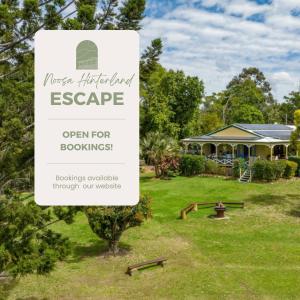 a sign in a yard with a house in the background at Noosa Hinterland Escape in Black Mountain