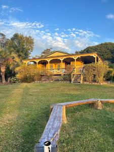 a house with a bench in front of it at Noosa Hinterland Escape in Black Mountain