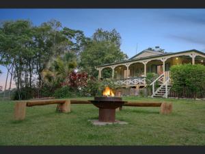 a fire fountain in front of a house at Noosa Hinterland Escape in Black Mountain