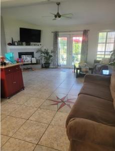 a living room with a couch and a star on the floor at Bedroom Four minutes from beach in Pensacola