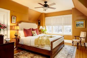 a bedroom with a bed and a ceiling fan at The Lady Mary Inn in North Berwick