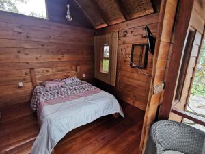 Postel nebo postele na pokoji v ubytování Cabaña del Lago