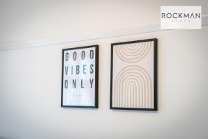 two framed prints on a wall in a room at Northumberland House 5 Bed Apartment Close To Beach with Parking by RockmanStays in Southend-on-Sea