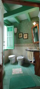 Koupelna v ubytování Facussa house + 9 fotografií
