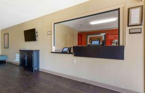 a waiting room with a large mirror on the wall at Extended Stay America Suites - Tulsa - Midtown in Tulsa