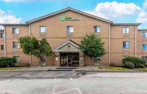 a large brown building with a sign on it at Extended Stay America Suites - Cleveland - Great Northern Mall in North Olmsted