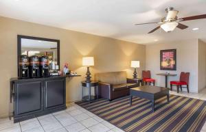 a living room with a couch and a ceiling fan at Extended Stay America Suites - Cleveland - Great Northern Mall in North Olmsted
