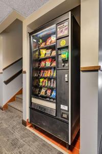 a vending machine in a room with food at SureStay Hotel by Best Western Spicer in Spicer