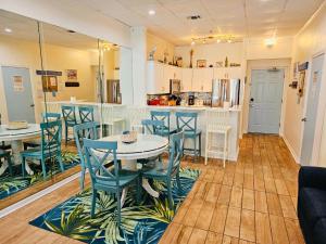 a kitchen and dining room with a table and chairs at Pensacola Beach Front Emerald Waters in Pensacola Beach