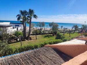 a view of the beach from the balcony of a resort at Estudio naturista 1 in Vera
