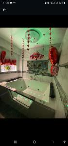 a counter in a room with red decorations on the wall at Hostal Paris in Lima