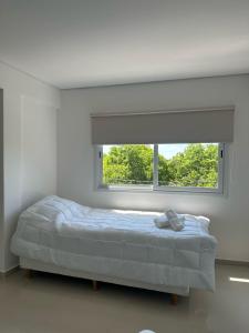 En eller flere senge i et værelse på Apart Deluxe 795 + 8 billeder