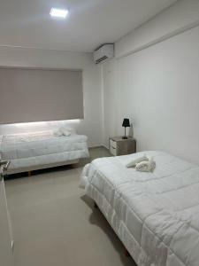 En eller flere senge i et værelse på Apart Deluxe 795