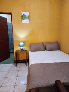 En eller flere senger på et rom på Casa Cempoal
