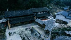 an overhead view of a house with snow on the roof at Nhà Cổ Lao Xa Homestay Hmong in Dồng Văn