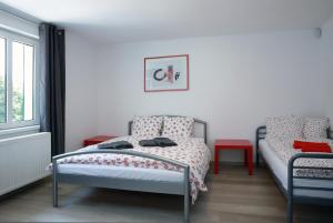 En eller flere senge i et værelse på Apartments Michovka