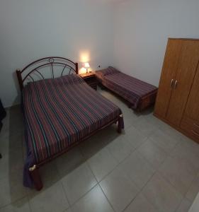Postel nebo postele na pokoji v ubytování Departamento La Lita