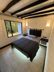 Postel nebo postele na pokoji v ubytování Luxury Finca el Ensueño, casa entera, con Sauna, Jacuzzi, BBQ y Caballos