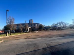 an empty street in front of a large building at The GuestHouse at Jackson in Jackson