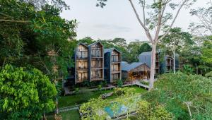 an aerial view of a house in the forest at Hotel Enai in Puerto Maldonado