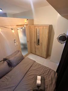 a bedroom with a large bed in a room at Makati SM Jazz Residence Staycation Condo with balcony in Manila