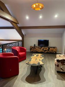 a living room with a couch and a table at Chalet Cristal II in Les Contamines-Montjoie