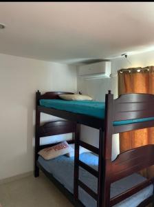 a couple of bunk beds in a room at Cabaña Roman in Cartagena de Indias