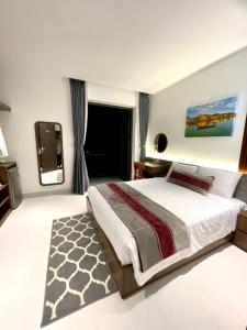a bedroom with a large bed and a television at The Dragon Villa Hoi An in Hoi An +134 photos