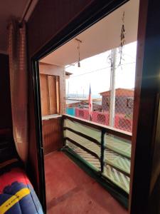 a view from the inside of a room with a window at CASA EN LOS VERDES in Iquique