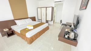 Krevet ili kreveti u jedinici u okviru objekta LPP Convention Hotel Demangan