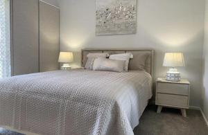 A bed or beds in a room at Ocean Spray Sawtell