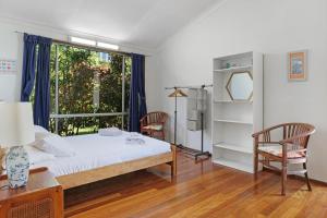 Ένα ή περισσότερα κρεβάτια σε δωμάτιο στο Siesta by the Sea