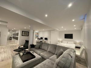 a living room with a couch and a bed at Luxury Executive Studio in Oakville