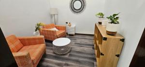 A seating area at MOOLOOLABA CANAL HOME - Modern 4Bedroom with Spa, Sauna and Private Pontoon - NEW proprietor 2024