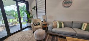 A seating area at MOOLOOLABA CANAL HOME - Modern 4Bedroom with Spa, Sauna and Private Pontoon - NEW proprietor 2024