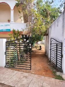 a gate in the side of a building with a fence at Hotel Plaza_Khajuraho in Khajurāho