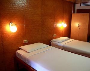 Postel nebo postele na pokoji v ubytování Ben Guesthouse