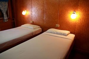 Postel nebo postele na pokoji v ubytování Ben Guesthouse
