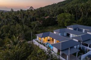 an aerial view of a house with a solar roof at Modern 3 Bedroom Villa! KBR16 in Koh Samui 