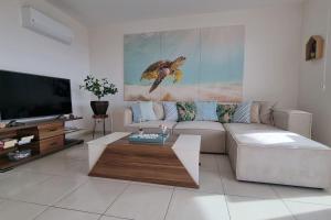 a living room with a couch and a coffee table at Scenic Sea View 2BR Apartment * 5min to Beach in Alanya