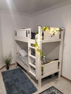 a white bunk bed in a room at ZED Hostel (Mix Share Studio) in Abu Dhabi